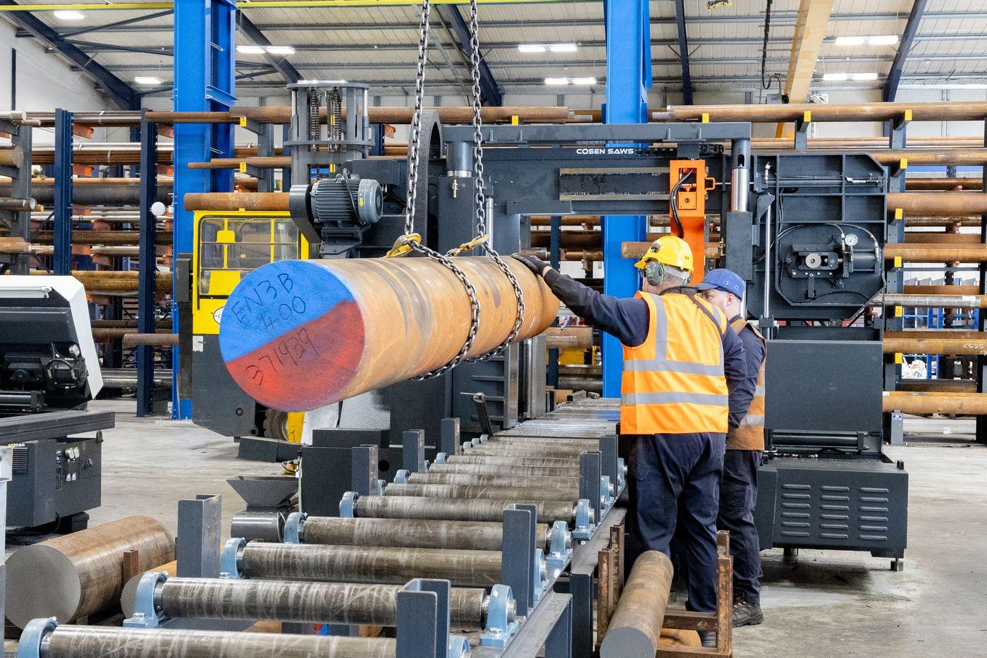 Parkside Steel team loading large diameter EN3B bar onto COSEN saw