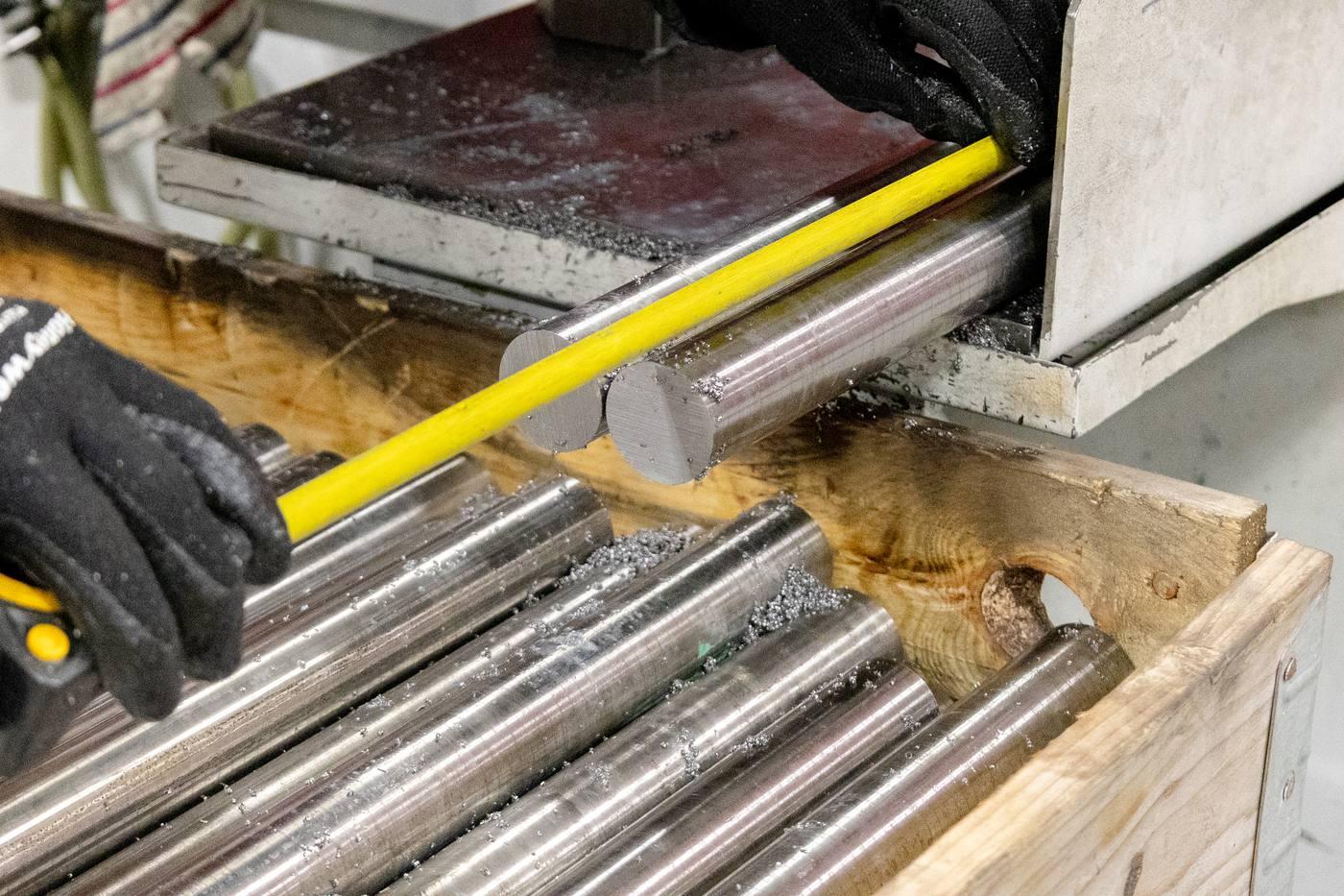 Operative measuring cut length with tape measure — precise cut-to-length service