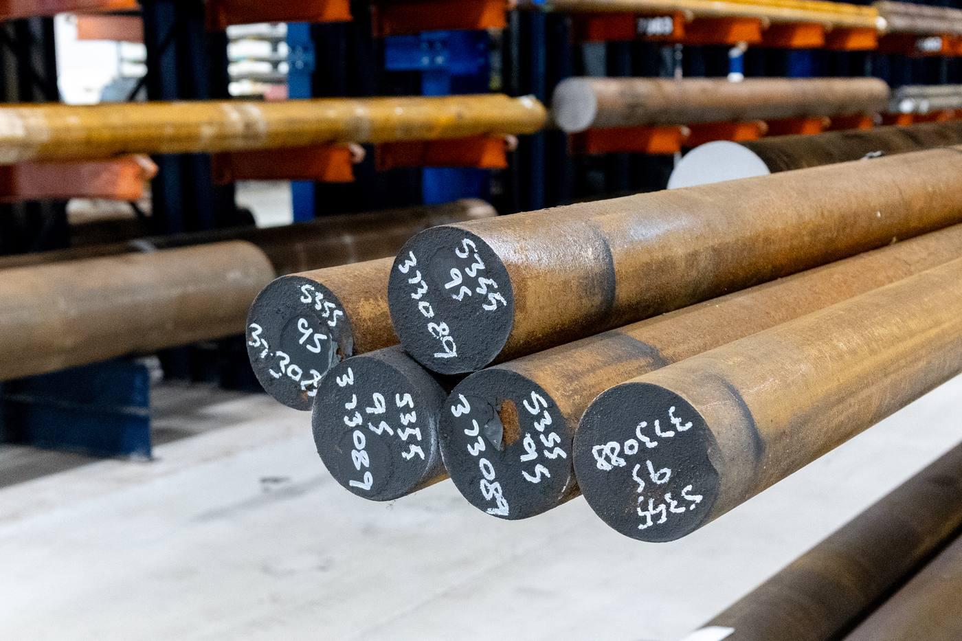 Large diameter black round bar ends with chalk grade markings — S355 400mm diameter black bar