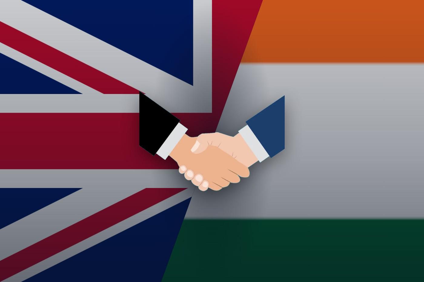 UK and India flags cut diagonally with a handshake at the centre, representing the UK–India trade agreement affecting steel imports